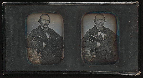 [Stereoscopic Portrait of Man Holding Stereoscopic Viewer]