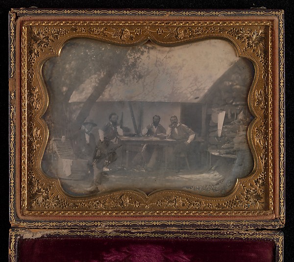 [Four Gold Miners Seated in Front of Their House]