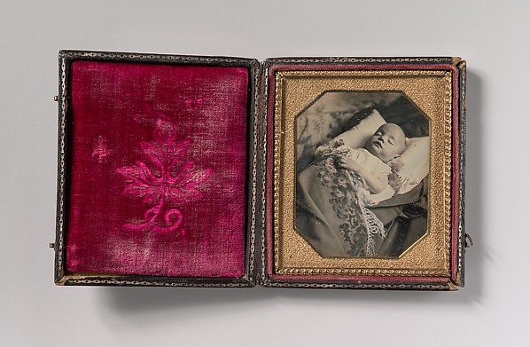 [Postmortem Baby, Partially Covered by a Flowered Shawl with a Fringe Hem]