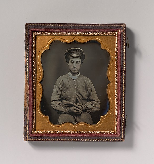 [House Painter Wearing a Cap and Holding a Paint Brush]