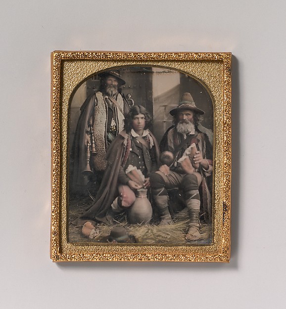 [Three Men in Shepherd Attire, One with Bagpipes, the Other Two Holding Bread]