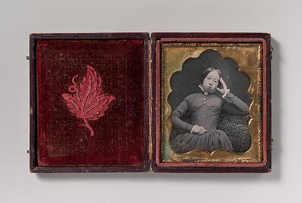 [Seated Woman Wearing Glasses]
