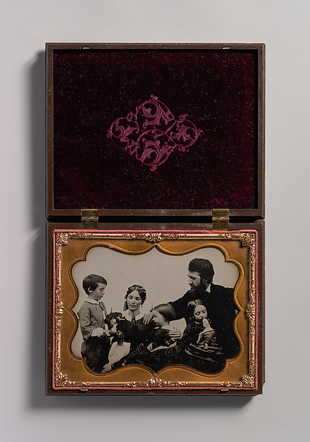 [Informal Studio Portrait of Young Family with Three Children]