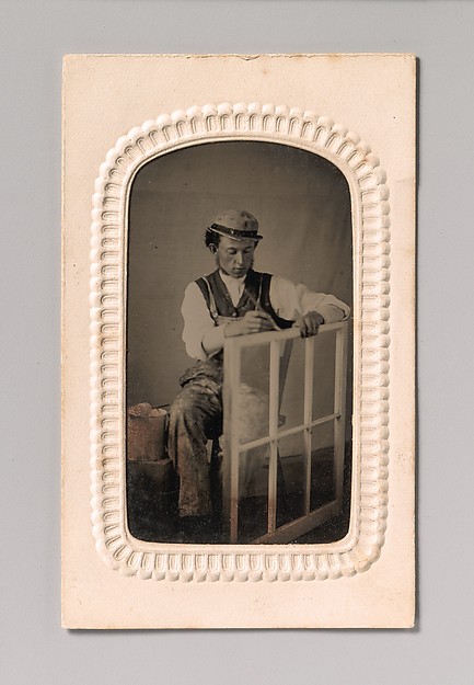 [Young Man Painting Window Frame]