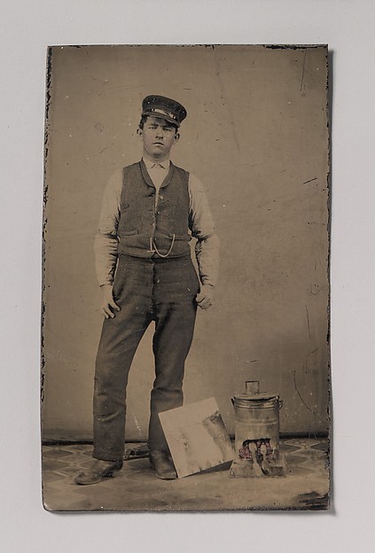 [Tinsmith with Coal Heater and Sheet of Tin]