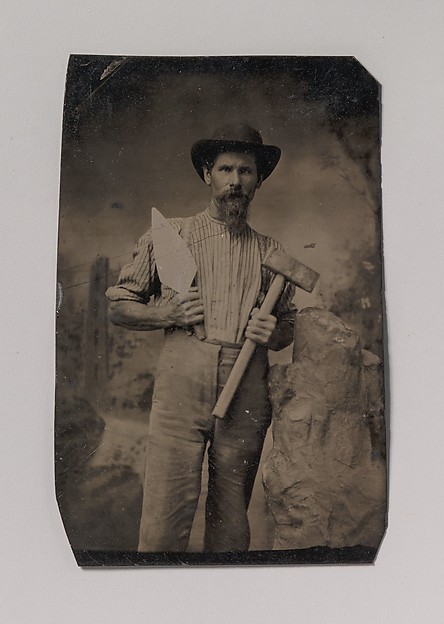[Mason (?) Holding a Trowel and Sledgehammer]