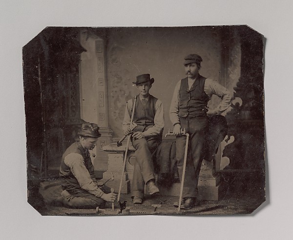[Three Plumbers with Pipes and Tools]