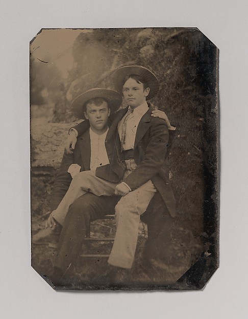 [Two Young Men in Straw Hats, One Seated in the Other's Lap]
