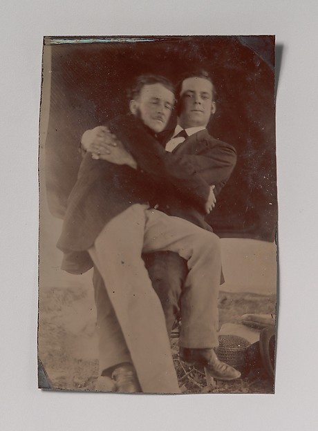 [Two Men Embracing, One Seated in the Other's Lap]