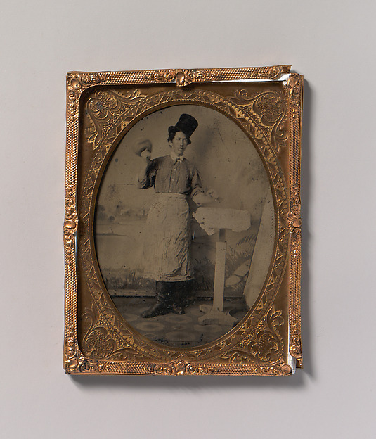 [Stone Mason in Top Hat and Apron with Mallet and Chisel]