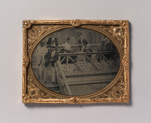 [Group of Men and Boys Standing Along the Railing of the Fulton Street Bridge]