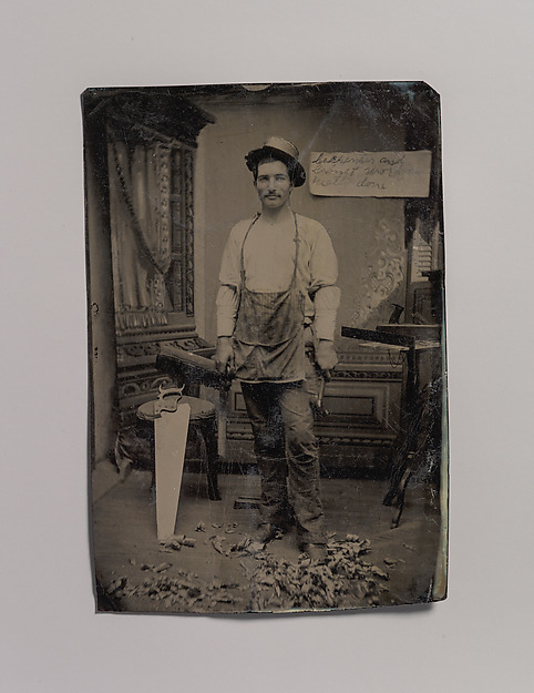 [Carpenter or Cabinetmaker Standing Before a Sign Advertising His Trade]