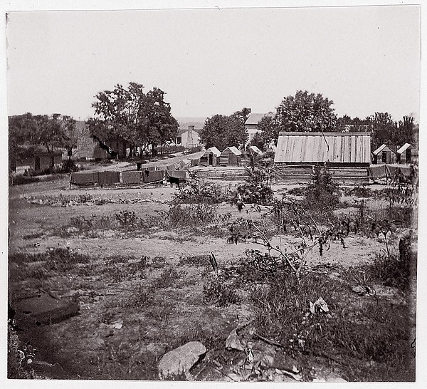 [View of a small town with wooden sheds in distance].  Brady album, p. 123