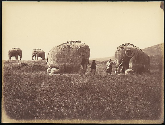 [Two Men by Monumental Elephant Statues, China]