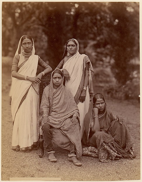 [Four Hindu Women, One Seated in a Chair, Outdoors]