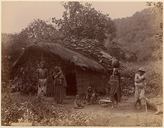 [Thatched House, People in Foreground, Telegraph Lines in Background]