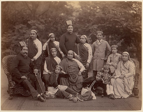 [Formal Family Portrait of Thirteen People, Men in European Dress]