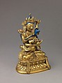 Buddhist deity Vajradhara in union with his consort Prajnaparamita, Gilt brass with copper base and applied color., probably Chinese or Tibetan