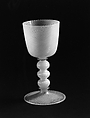 Colorless (slightly tan) and opaque white nonlead glass. Blown, "vetro a reticello"., Italian, Venice