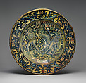 Dish (piatto); The story of Hercules: the gods called upon Hercules to help them defend Olympus against the attack of the Giants, sons of Uranus and Gaea (Heaven and Earth), Maiolica (tin-glazed earthenware), Italian, Deruta