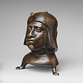 Aquamanile in the Form of a Human Head, Bronze; Ternary copper alloy with a very high percentage of zinc (approx. 68% copper,
approx. 26% zinc, approx. 4% tin), covered with a thin black lacquer patina; traces of cinnabar have been detected on the interior and exterior of the vessel., German or French, Paris (in fourteenth-century Hildesheim style)