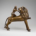 Aquamanile in the Form of Samson and
the Lion, Bronze; quaternary copper alloy (approx. 78% copper, approx. 10% zinc, approx. 6% tin, approx. 5% lead) with natural patina. Remnants of the iron armature are in the lion’s legs and the figure of Samson., Northern European (?), possibly German