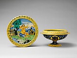 Broth bowl and cover (scodella and tagliere) from an accouchement set; Aeneas leaving Troy with his father and son (inside bowl); Pyramis and Thisbe (on cover), Baldassare Manara (Italian, Faenza, active first half 16th century), Maiolica (tin-glazed earthenware)