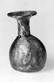 Dropper flask, Almost colorless glass with a pale green or yellow tint.  Blown (the body blown in a dip mold), tooled, the rim finished at the furnace., Roman
