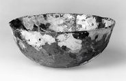 Bowl, Transparent pale yellowish brown glass. Perhaps blown, the rim apparently finished by reheating., Roman