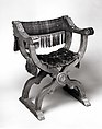Hip-joint armchair (Dantesca type), Walnut, carved; silk cut velvet, metal., Italian (?)