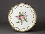 Louis XVI round table with sevres top, Oak veneered with tulipwood, rosewood, green-stained maple, holly stringing; legs veneered with rosewood and partly shaded satinwood; gilt-bronze mounts., French, Paris