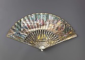 Folding fan, Leaf: gouache and bronze paint on paper.
Sticks and guards: mother-of-pearl, carved, pierced and veneered, decorated with gold-and-silver-toned metal leaf.
Pivot: green paste jewel., Austrian or German